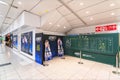 Posters, bulletin board and life size standees of the Japanese anime City Hunter in Shinjuku station.