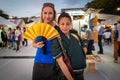 Tokyo, Japan - September 23, 2019: A blonde caucasian woman posing with a Japanese cosplayer.