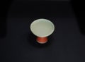 isolated sake cup or sakazuki on black background