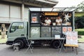 Tokyo, Japan - December 20, 2020 : two asian chefs preparing pizza for sell on the japanese food truck in the park at Tokyo