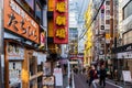 TOKYO, Japan, Shibuya. 11/11/2019. Colorful street life with many neons, signboards, cables and japanese people wearing face masks