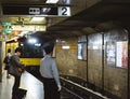 Tokyo, Japan - Subway train arriving the station and the security officer standing on the platform. Royalty Free Stock Photo