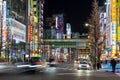 Tokyo`s famous electronics shopping area, Akihabara`s main street neon signs light up the night Royalty Free Stock Photo