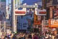 Main gate of the Azuma Dori shopping street meaning of Shimokitazawa with crowds of people.