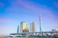 Tokyo Sky tree viewed from Azumabashi Riverside at Sumida river viewpoint under dusk sunset