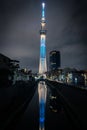 Tokyo Skytree Tower illumination at night with reflection in the river