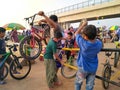 Tol Cibitung Cilincing, Bekasi, Indonesia -People's who are lifting bicycles, passing the road divider portal