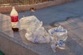 Toledo, Castilla La Mancha, Spain; December 23 2.017: Remains of Coca bottle garbage and ice bags in a park