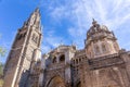Toledo Cathedral, Gothic church facade with great portals, statues, reliefs, bell tower, Spain.
