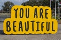 You Are Beautiful, a wood painted sculpture by Chicago artist Matthew Hoffman along the Maumee Riverfront