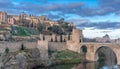 Alcantara bridge over the Tagus Tajo river, Gate and the city walls. Toledo, Spain