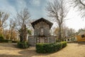 Toledo, Spain - Dec 17, 2018: Old wood house, covered by bark surrounded by the bare winter trees in the center of Park La Vega in