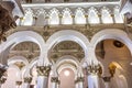 Toledo, Spain - Oct 08, 2022: White arches at Ancient Sinagoga d