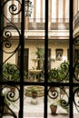 Forged metal door and entrance to patio of typical house in Toledo