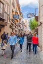 TOLEDO, SPAIN - OCTOBER 23, 2017: People walking in a narrow street in the old town of Toledo, Spa Royalty Free Stock Photo