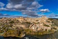 Toledo, Spain. Old city with its Royal Palace over the Tagus River sinuosity Royalty Free Stock Photo