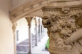 Stone, carved column capital close-up with lion head in the Museum of Santa Cruz in Toledo, Spain Royalty Free Stock Photo