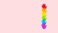 Tolerance, kindness, cooperative, friendship, charity humanitarian aid day concept. Many rainbow color palm hands on pink