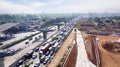 Toll road with hectic traffic and construction pilings Royalty Free Stock Photo