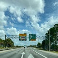 A toll road sign that designates where people should drive to pay tolls for EPass and Sunpass in Orlando, Florida