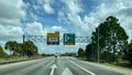 A toll road sign that designates where people should drive to pay tolls for EPass and Sunpass in Orlando, Florida