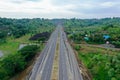 The toll road stretches across the plantation area