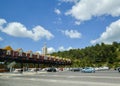 Toll station at the entrance to the 25th April Bridge between Lisbon and Almada, Portugal. Cars passing through pay Royalty Free Stock Photo