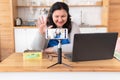 A tolstaya woman leads a video blog in a room, in the office. Royalty Free Stock Photo