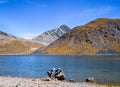 TOLUCA, MEXICO, JANUARY 14, 2018: A couple rests on a stone and contemplates the landscape of the Nevado de Toluca.