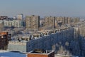 Panorama of snow-covered residential areas of the Avtozavodsky district in the rays of the morning sun.