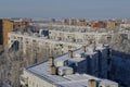 Panorama of snow-covered residential areas of the Avtozavodsky district in the rays of the morning sun.