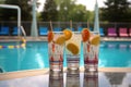 tom collins in unique glassware with pool view