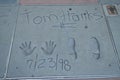 Tom Hanks cast place hand prints in cement at Hollywood`s Chinese Theatre, Los Angeles, California, United States of America