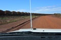 Car driving on the rail access road Tome Price Western Australia Royalty Free Stock Photo