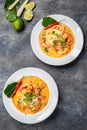 Tom Yam Kung ,Prawn and lemon soup with mushrooms, thai food in two white bowl top view Royalty Free Stock Photo