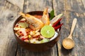 Tom Yam Kung ,Prawn and lemon soup with mushrooms, thai food in wooden bowl top view Royalty Free Stock Photo