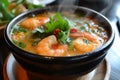 Tom Yum Goong: Spicy shrimp soup with lemongrass, chili, and a citrusy kick, served steaming hot Royalty Free Stock Photo