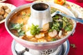 Tom Yum Goong, spicy soup with shrimp in a hot pot. Royalty Free Stock Photo