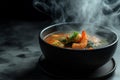 Tom Yum Kung in a black bowl
