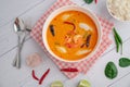 Tom Yum Kung and Fish Balls, Thai food placed on white wooden scene with side dishes