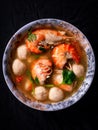 Tom Yum Kung with Pork Balls spicy and sour Colorful, appetizing, put in a container