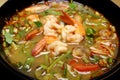 Tom Yum Kung Shrimp soup with milk, meat, fish, mushrooms spicy