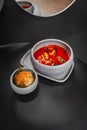 Tom Yum Kung spicy Thai soup with shrimp in a grey bowl