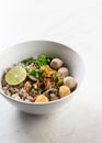 Tom Yum Noodles , Noodles with light Tom yum spicy soup with meatballs, lime, minced ground pork Royalty Free Stock Photo