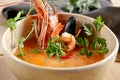 Tom yum soup in beige ceramic bowl top view Royalty Free Stock Photo