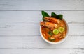 Tom yum soup. Tom yam kung is a thai spicy soup with shrimps, lemongrass,lime, ginger, galangal and coconut milk. Space for text Royalty Free Stock Photo