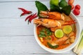 Tom yum soup. Tom yam kung is a thai spicy soup with shrimps, lemongrass,lime, ginger, galangal and coconut milk. Space for text Royalty Free Stock Photo