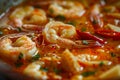 Tom Yum, Traditional Red Sour Thai Soup, Hot Chili Tom Yam with Squid, Shrimps, Red Peppers Royalty Free Stock Photo