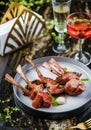 Tomahawk rib beef steak on bone with sauce on plate over marble background. Hot Meat Dishes, top view, selective focus Royalty Free Stock Photo