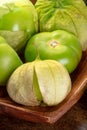 Tomatillos, green tomatoes, Mexican food ingredient on a dark rustic background Royalty Free Stock Photo